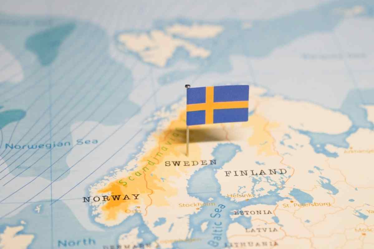 Swedish flag on top of Sweden's map