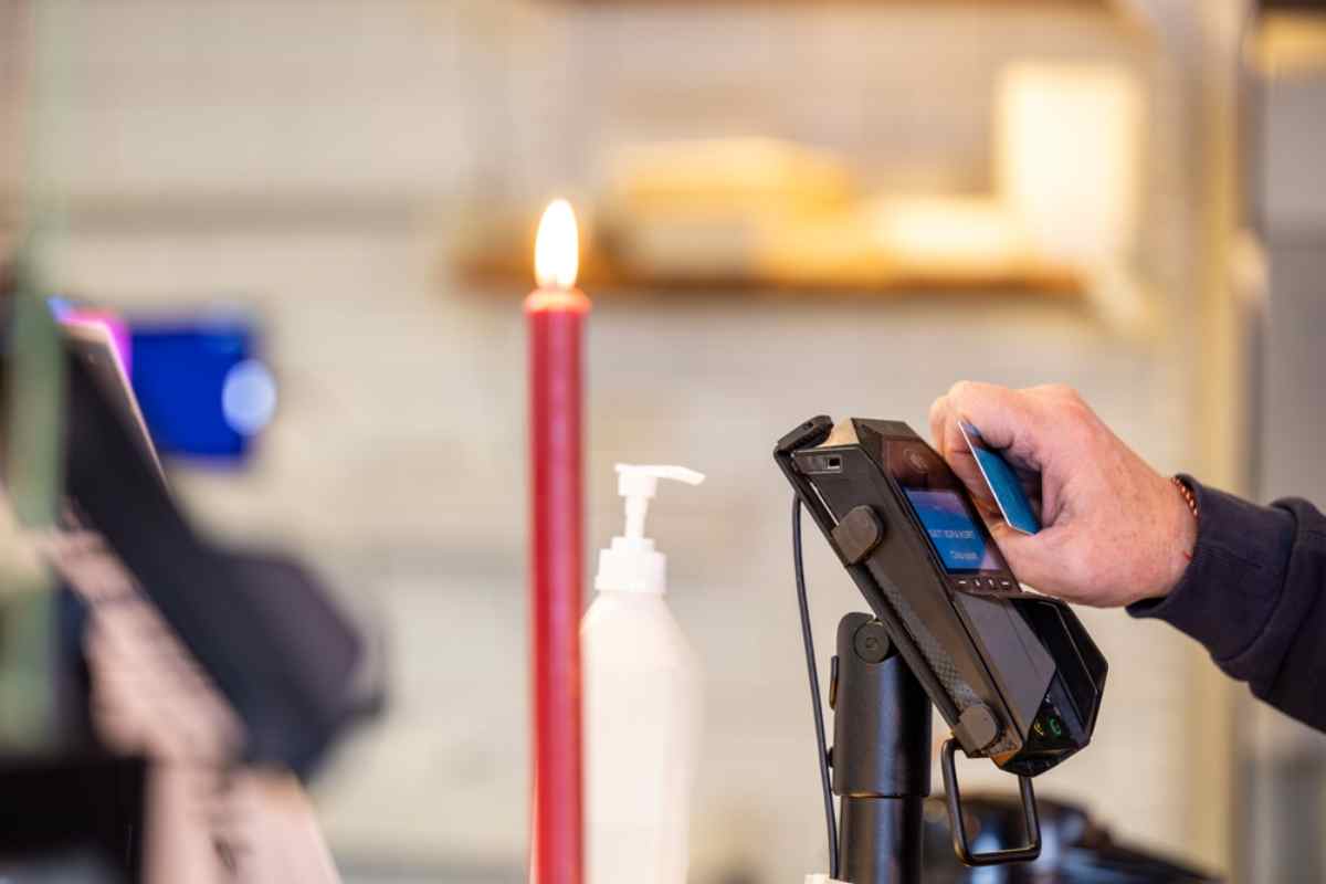 General view of a credit card reader as a consumer in a Swedish store swipes his credit card.